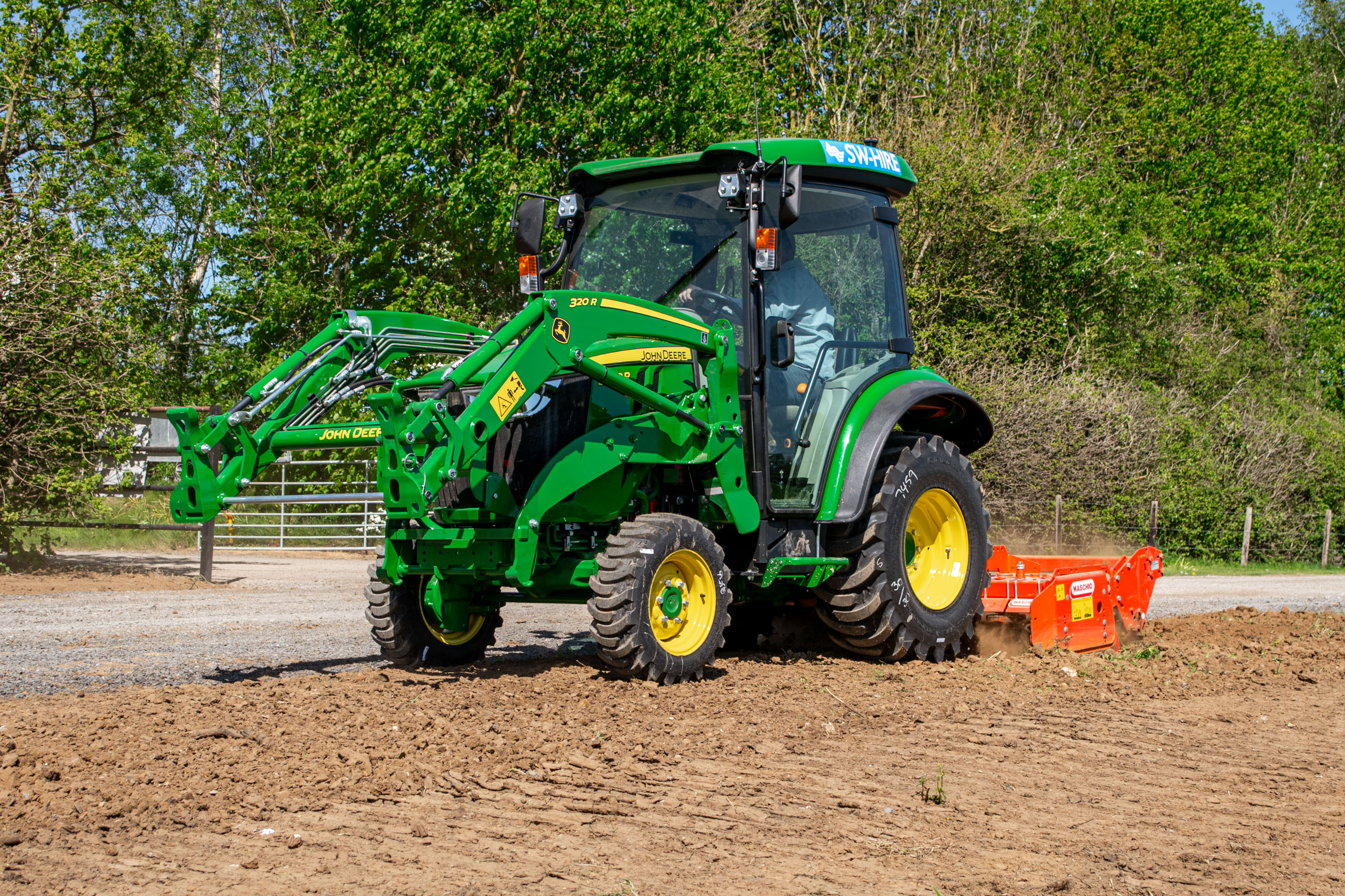 john deere 3039R with front loader and maschio power harrow